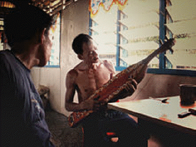 Sape_Player,_Kayan_Tribe,_Sarawak_(7246809770)